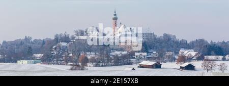 Andechs, Germany - Dec 3, 2020: Panorama of Andechs Abbey during winter time. Snow-covered bavarian landscape with famous monastery. Stock Photo