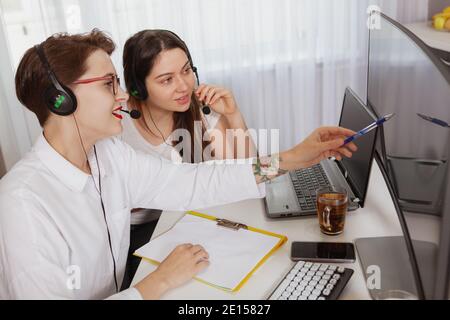 Busy call center operators in a modern office Stock Photo - Alamy