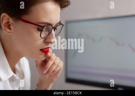 Cropped close up of a young attractive female entreprenurs working in front of her computer. Employee, career concept Stock Photo
