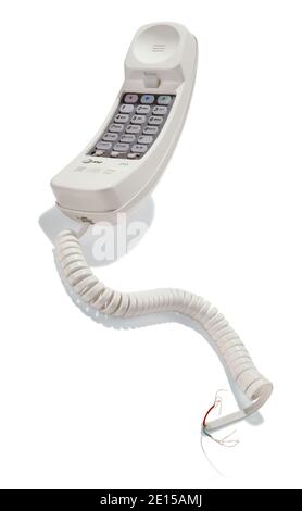 Land line phone with cord cut photographed on a white background Stock Photo