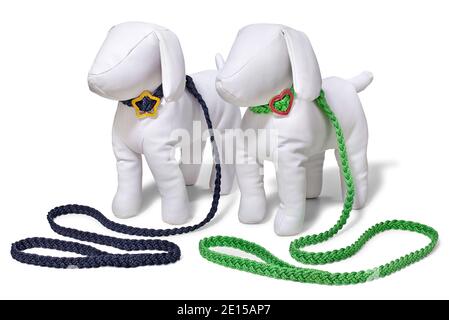 Two dog leashes in black and green on plush dog mannequin with cute metal buckle photographed on a white background. Stock Photo