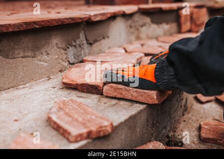 Sandstone floor tiles - granite pieces of different shapes and sizes for decoration Stock Photo