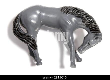 Grey plastic toy horse photographed on a white background Stock Photo
