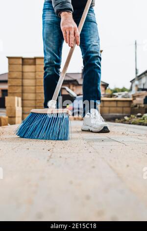 Professional laying of road stone and paving slabs for walking and parking - sidewalk paving Stock Photo