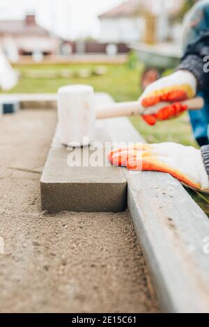 Professional installation of tiles on glue - high quality exterior finishing works Stock Photo