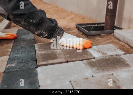 Professional installation of tiles on glue - high quality exterior finishing works Stock Photo