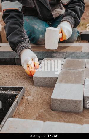 Professional installation of tiles on glue - high quality exterior finishing works Stock Photo