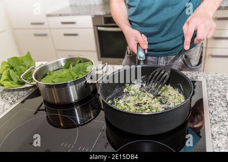 Chef Blanching With Saucepan And Spatula Stock Photo