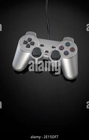 Video game controller on black background photographed on a white background Stock Photo