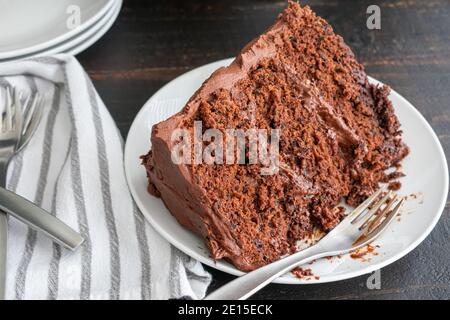 Chocolate Stout Cake with Chocolate Bourbon Sour Cream Frosting: A slice of chocolate cake made with beer and whiskey Stock Photo