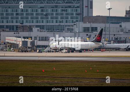 Montreal, Quebec/ Canada - 11/29/2020 : Air Canada 737 MAX parked at terminal getting ready for a test flight. Stock Photo