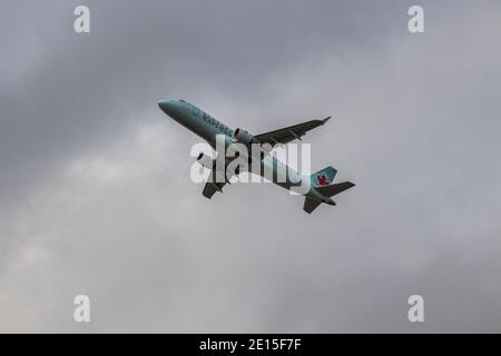 Montreal, Quebec/ Canada - 11/29/2020 :  Air Canada's Embraer E175 with old blue livery, leaving Montreal's Intl. Airport. Stock Photo