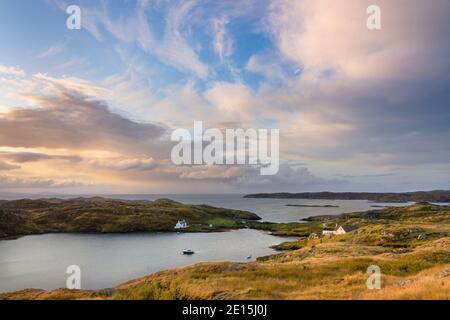 South Harris, Isle of Lewis and Harris, Scotland: Clearing morning storm clouds over an isolated coastal village Stock Photo