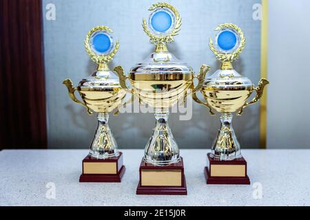 Three cup trophies, gold, silver and bronze Stock Photo