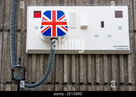 Large plug & socket artwork on the side of an electricity substation on the corner of Marshall Street & Ganton Street in Soho. Stock Photo