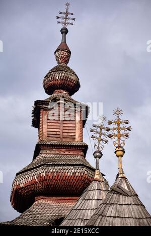Wooden Church of the Nativity of the Blessed Virgin in Pilipets, Ukraine. 18th century with two-tier wooden bell tower Stock Photo