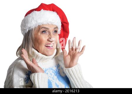 Portrait of surprised senior woman in Santa hat Stock Photo