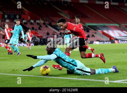 Liverpool's Sadio Mane goes down after being tackled by Southampton's Kyle Walker-Peters during the Premier League match at St Mary's Stadium, Southampton. Stock Photo