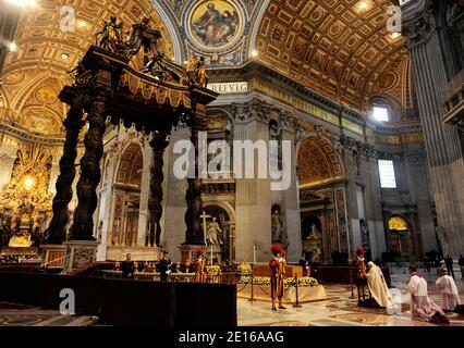 Pope Benedict XVI kneels before the coffin of his predecessor Pope John Paul II in St. Peter's Basilica after the beatification ceremony. Pope Benedict XVI beatified Pope John Paul II before more than a million faithful in St. Peter's Square at the Vatican on May 1, 2011. Photo by ABACAPRESS.COM Stock Photo
