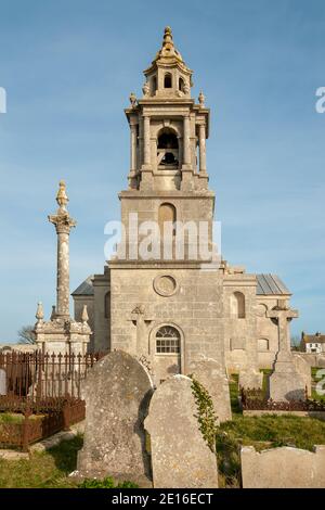 PORTLAND, DORSET, UK - MARCH 15, 2009:  Exterior view of St George's Church in with old gravestones in the graveyard Stock Photo