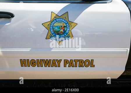 Detail of California highway patrol state trooper car door at Stars & Stripes classic American car Stock Photo