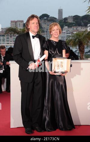 Producers Bill Pohlad (L) and Dede Gardner pose with the Palme d'Or for 'The Tree of Life' pose at the Palme d'Or Winners Photocall at the Palais des Festivals during the 64th Cannes Film Festival in Cannes, France on May 22, 2011. Photo by Giancarlo Gorassini/ABACAPRESS.COM Stock Photo