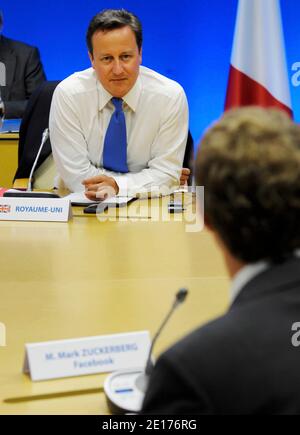 Britain's Prime Minister David Cameron speaks with Facebook founder and Chief Executive Officer Mark Zuckerberg during the G8 Summit in Deauville, western France on May 26, 2011. Photo by Philippe Wojazer/Pool/ANACAPRESS.COM Stock Photo