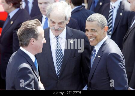 (L-R) British Prime Minister David Cameron, International Monetary Fund's Acting Managing Director John Lipsky and US President Barack Obama pictured as they leave the Villa Le Cercle after a working lunch during the G8 summit in Deauvillee, France on May 27, 2011. G8 leaders sought Friday to thrash out a common position on how to support Arab democratic revolts, brandishing a threat of action against Syria and demanding Libyan leader Moamer Kadhafi go. Photo by Albert Facelly/Pool/ABACAPRESS.COM Stock Photo