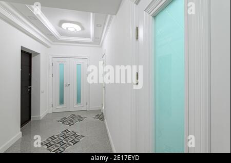interior of white hallway with doors Stock Photo