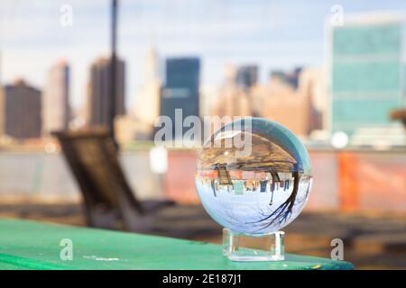 New York City seen through glass ball from Long Island City Stock Photo