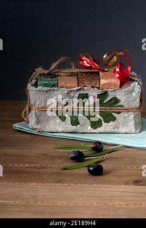 Davis, California, USA, 5 December 2020.  Pasture 42 organic olive soap packaged in recycled paper, on wooden background. Located in Guinda, Californi Stock Photo