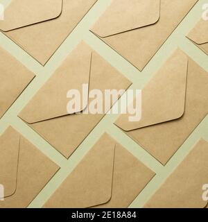 Kraft brown paper envelopes on khaki background. top view, copy space Stock Photo