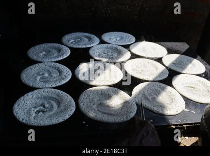 A Tamil cook preparing a Dosa. Stock Photo