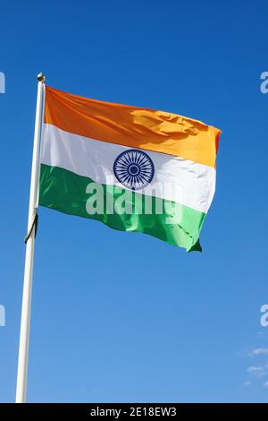 The Indian flag against the blue sky. Stock Photo