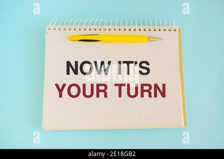 Now it's your turn text, inscription, phrase written in a notebook Business concept Stock Photo