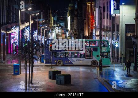 Glasgow, Scotland, UK. 5th Jan, 2021. Pictured: Busses are running but empty. Yesterday at 2pm the Scottish First Minister announced that there would be a lockdown commencing midnight. Scenes from early this morning during what would normally be a busy rush hour, only sees a handful of commuters going about their business. Glasgow City centre is empty and deserted. People have been told to stay in their homes unless its for essential traveller places like work or to get essential food items or exercise. Credit: Colin Fisher/Alamy Live News Stock Photo