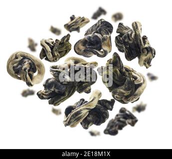 Dried Oolong tea levitates on a white background Stock Photo