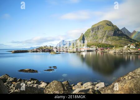 Panorama of A - village, Moskenes, on the Lofoten in northern Norway. Norwegian fishing village, with the typical rorbu houses. Mountain In Background Stock Photo