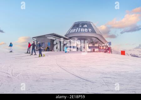 Saalbach, Austria - March, 5, 2020: Skiers and snowboarders ready for skiing from top ski lift station Stock Photo