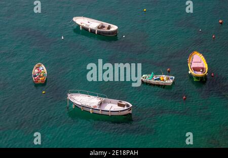 In the port of Corricella, island Procida, Italy, there are many different fishing boats. Stock Photo