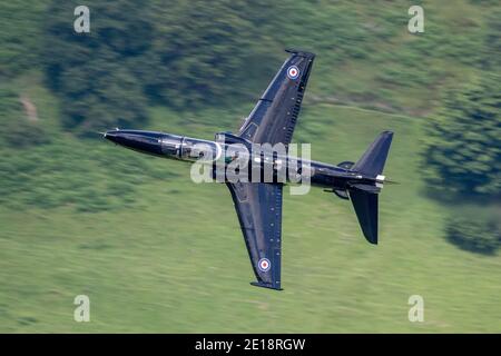 Royal Air Force (RAF) Hawk T2 Jet Trainer flying low level in the mountains Stock Photo
