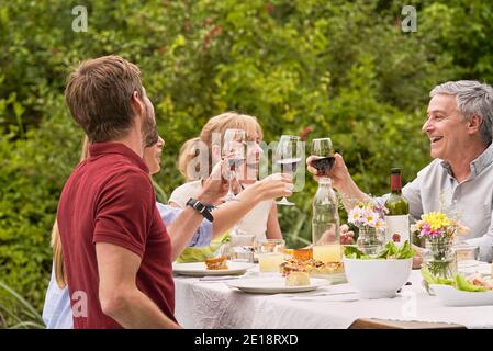 Family having lunch in garden Stock Photo