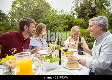 Happy family having meal Stock Photo