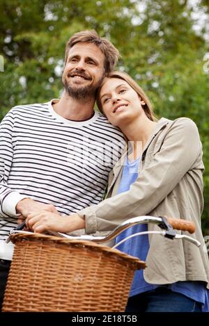 Smiling mid adult couple looking away Stock Photo
