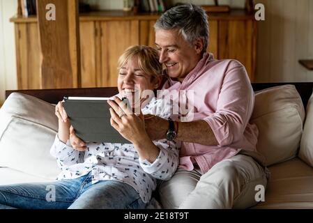 Senior couple using digital tablet Stock Photo