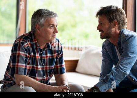 Father talking with son Stock Photo