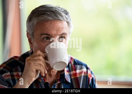 Close-up of senior man drinking coffee Stock Photo