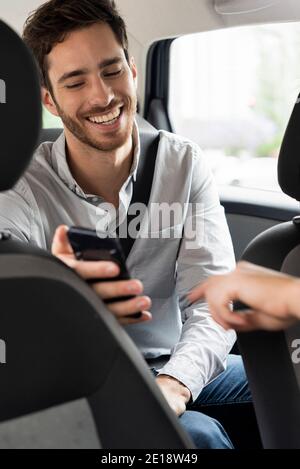 Taxi driver's hand pointing touch screen Stock Photo