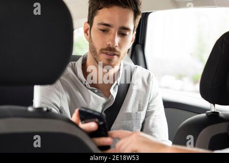Taxi driver's hand pointing touch screen Stock Photo