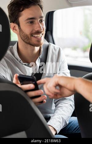 Taxi driver's hand pointing touch screen Stock Photo